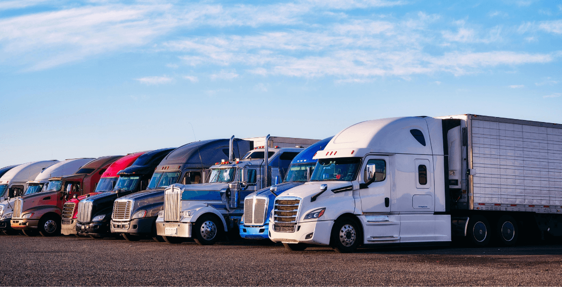 line of fleet of trucks in the parking lot