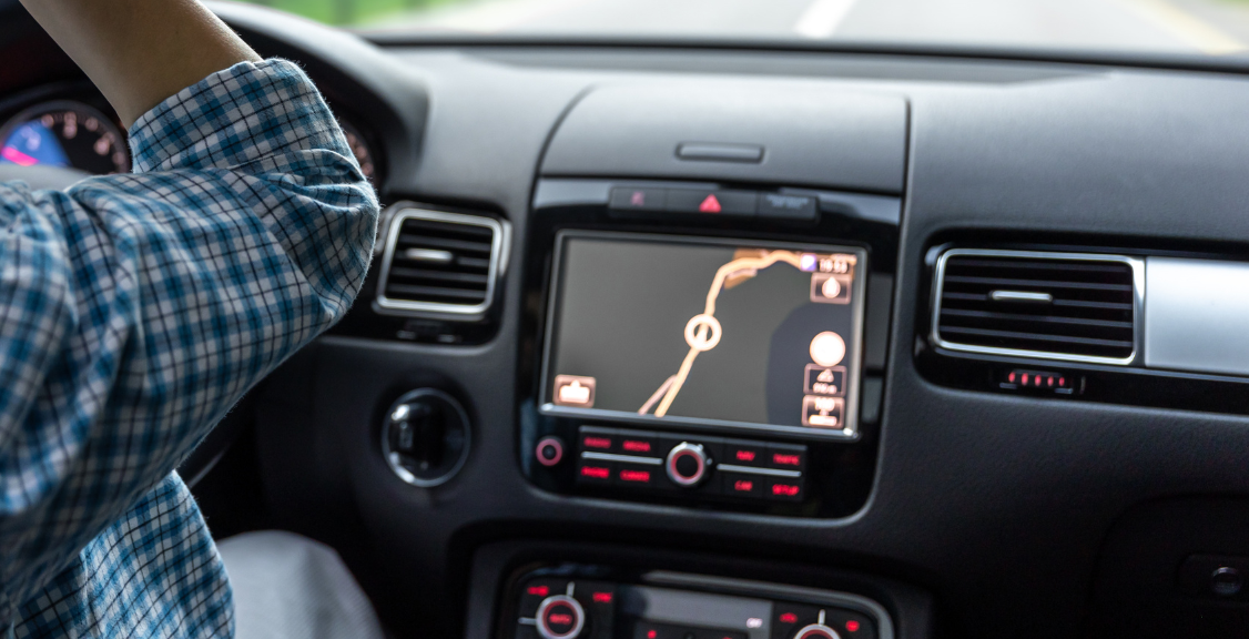 Woman driving a car with location gps tracker