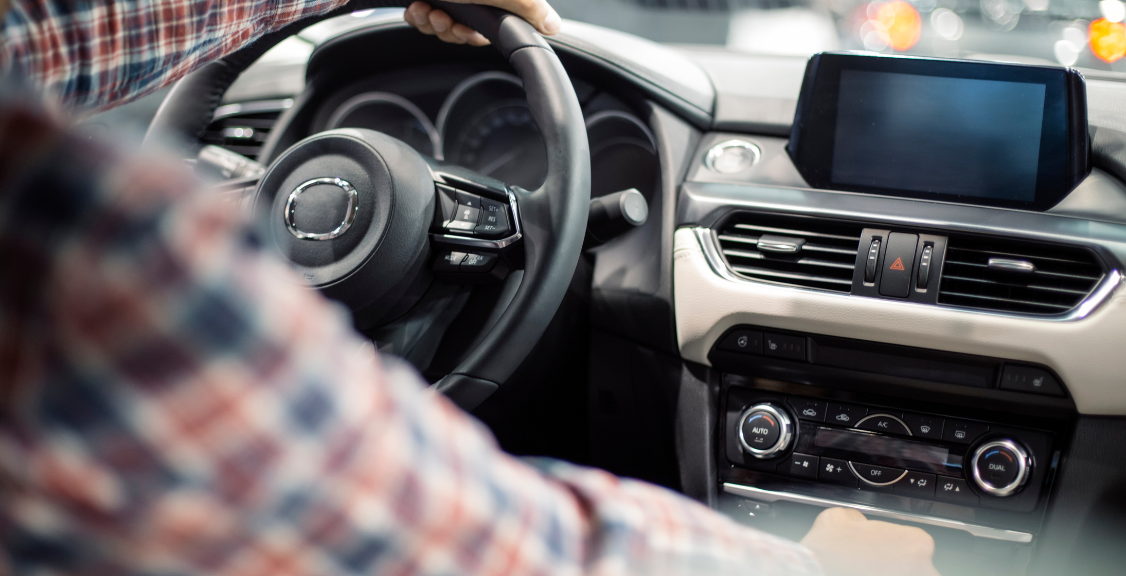 Cropped shot of a person traveling by car using the on-board GPS to navigate