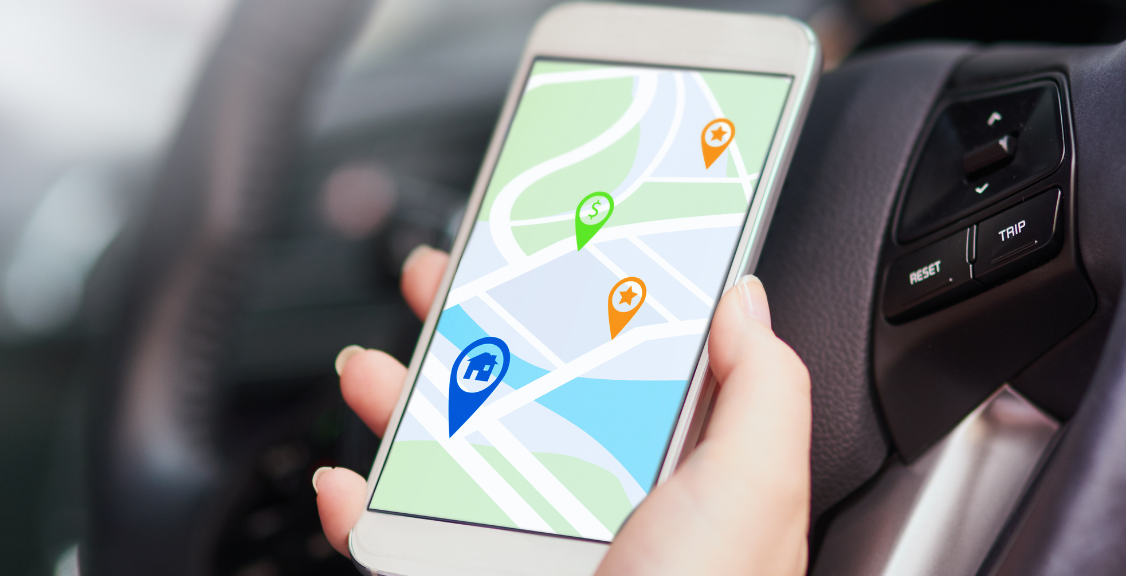 a person in a car using their phone to find directions