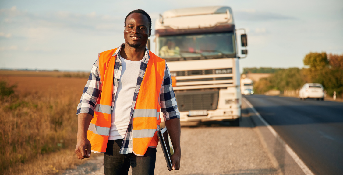 a truck driver smiling walking away