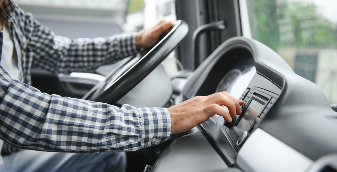 driver behind the wheel in truck cabin