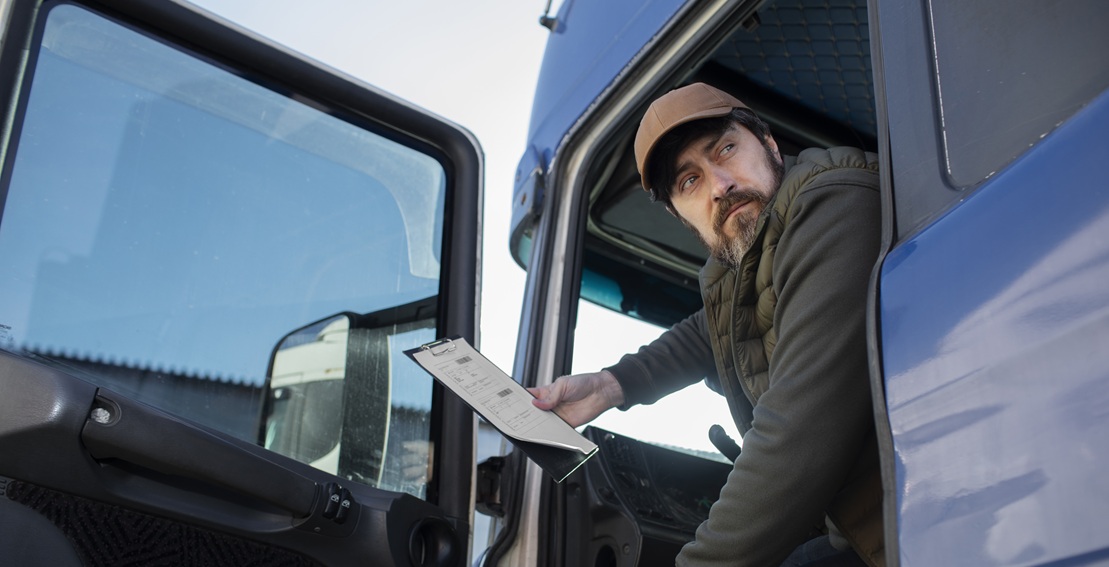 low angle man sitting truck fleet management